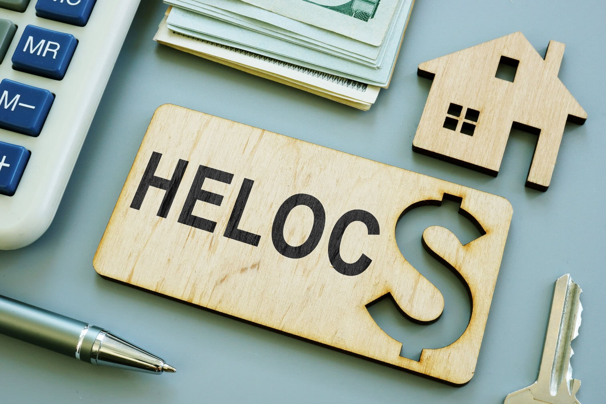 wooden plank with sign heloc home equity line of credit.