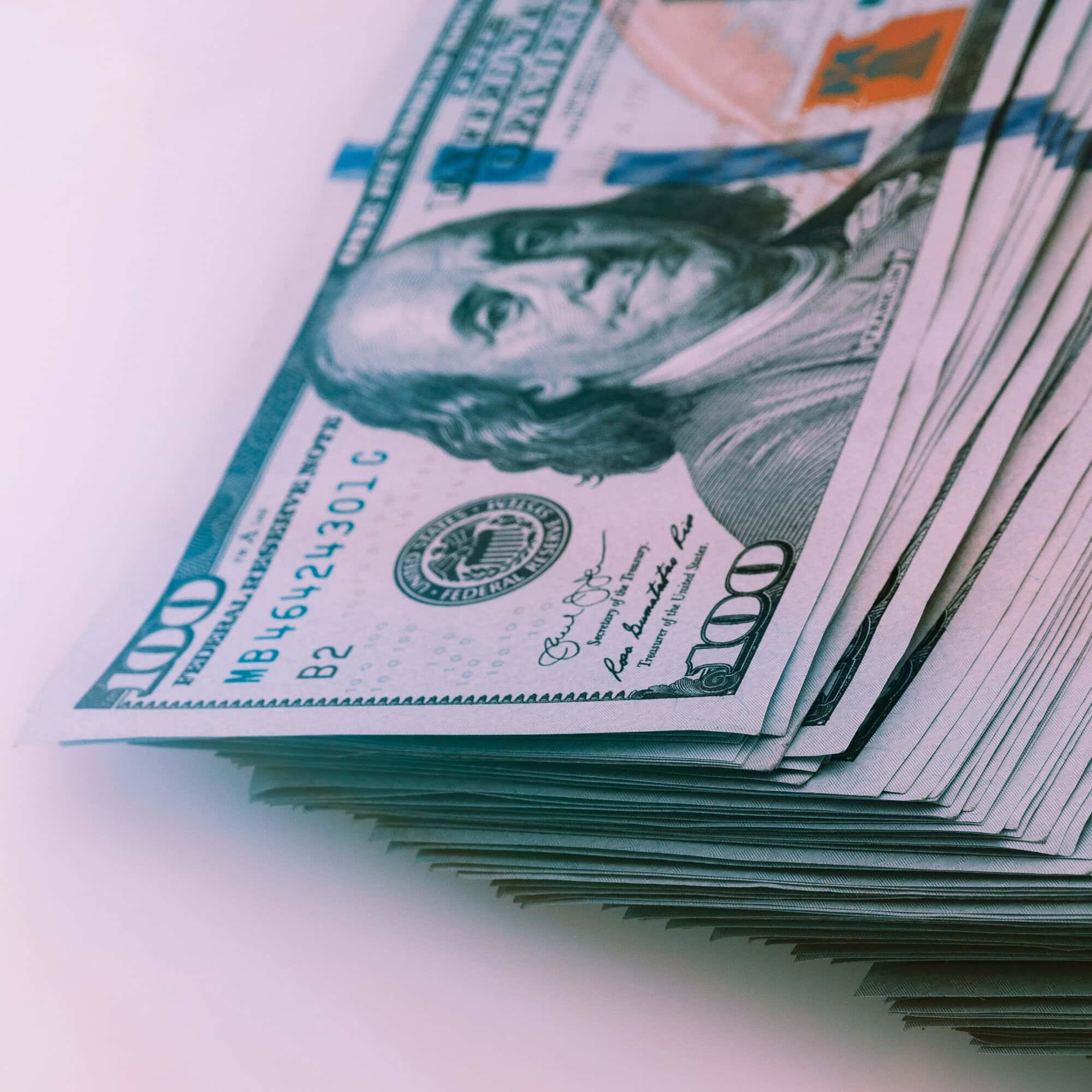 banknotes of dollars are stacked in a row.
